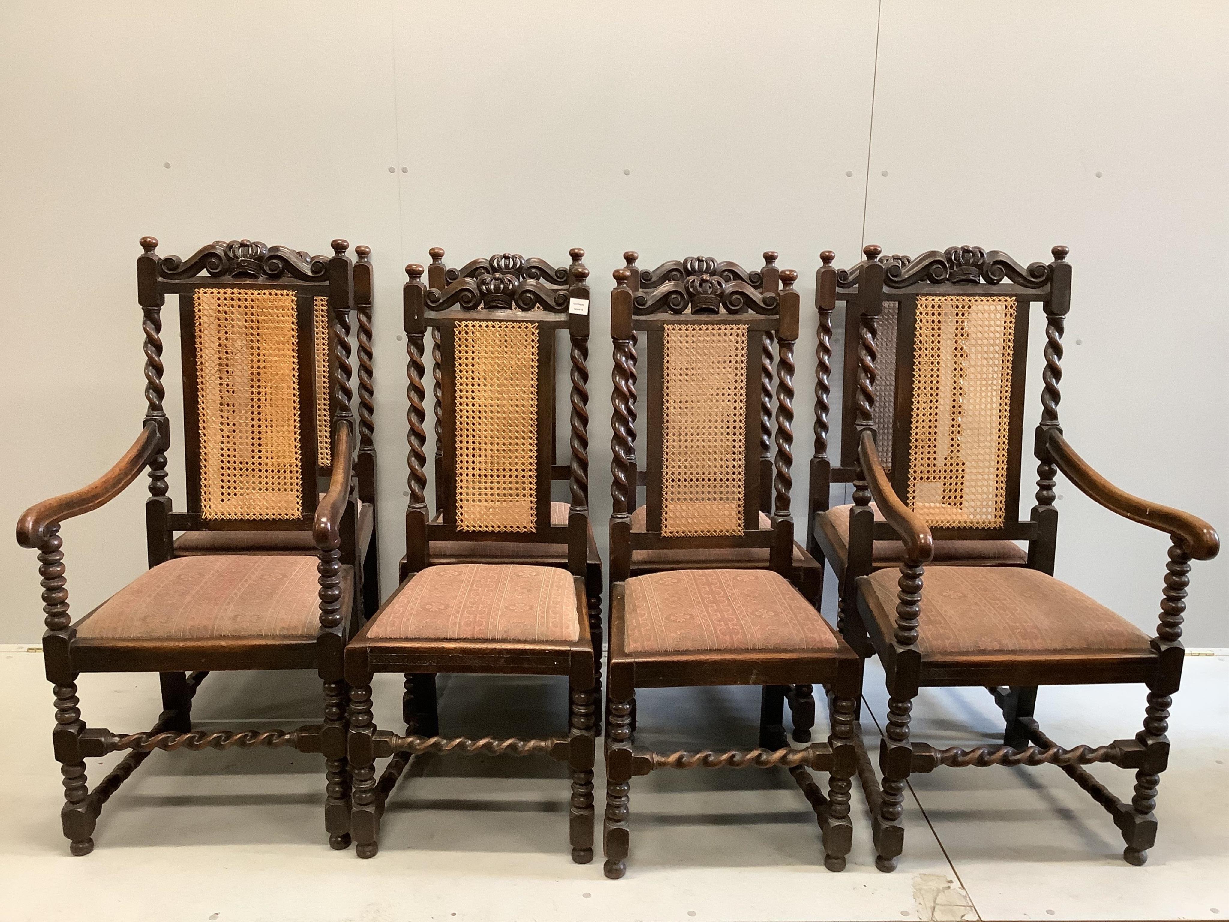 A set of eight late 19th century Carolean style carved oak caned back dining chairs, (6 single, 2 arms). Condition - fair